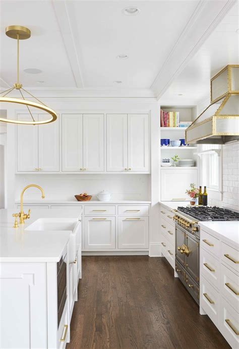 black granite white cabinets gold pulls stainless steel appliances|modern white and gold cabinets.